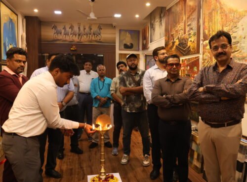 Traditional lamp lighting ceremony marking the inauguration of an art exhibition in Mumbai at JMD Art Gallery.